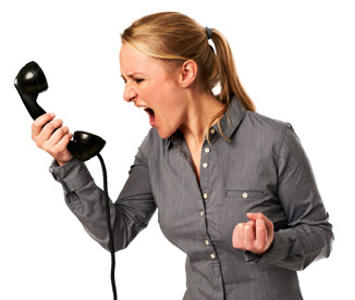 Office worker yelling at phone because of one-way audio.