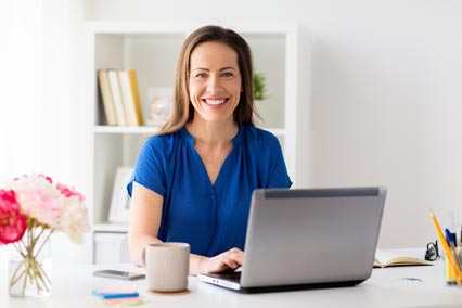 Remote work from home with a computer on a desk.