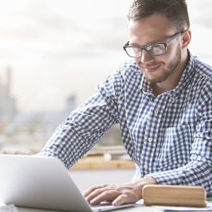 Salesman engaged in a video meeting from home.