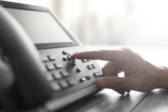 PBX desk phone being used.